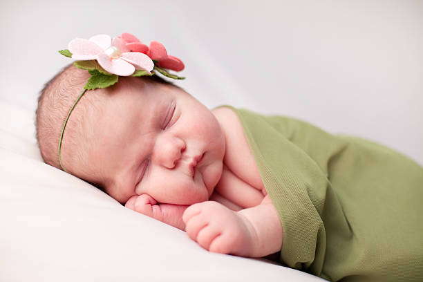 istock Beautiful baby girl sleeping peacefully 184388307
