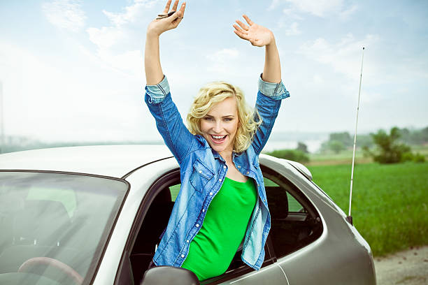istock Beautiful Blonde in her car 184388768