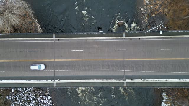 Drone footage of a car driving on a bridge crossing the St. Croix River in Minnesota, USA