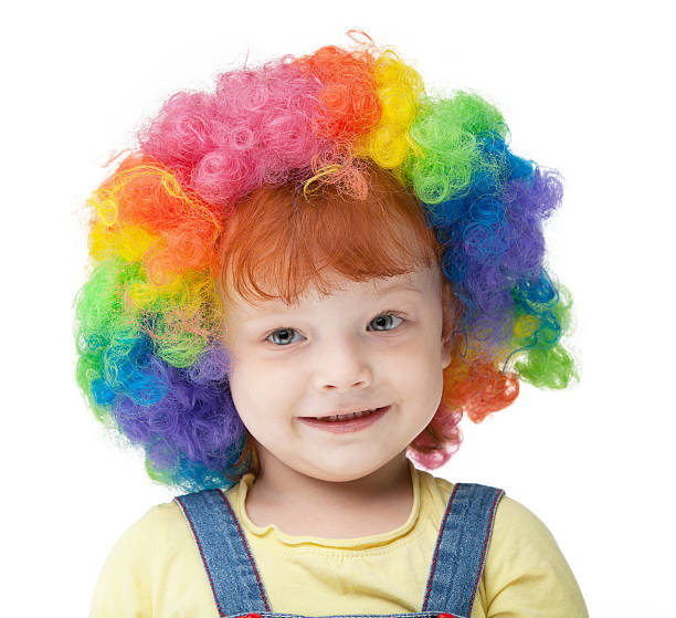 istock Young girl with clown wig 184392466