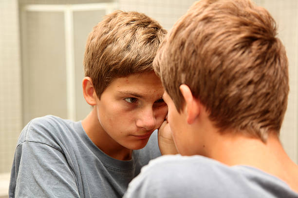istock Pondering teenage boy 184392851