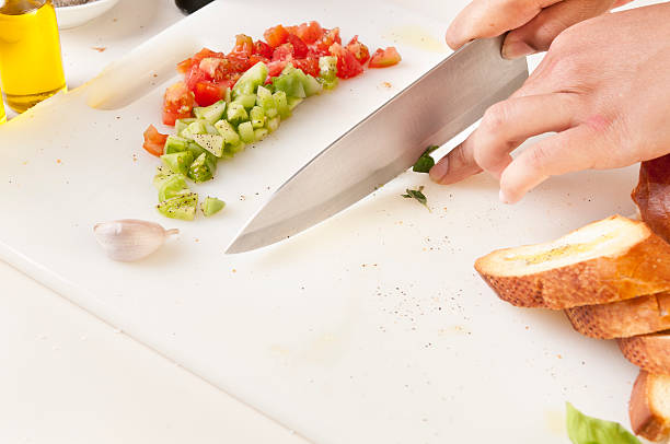 istock Chiffonade of Basil on Cutting Board with Knife 184393376