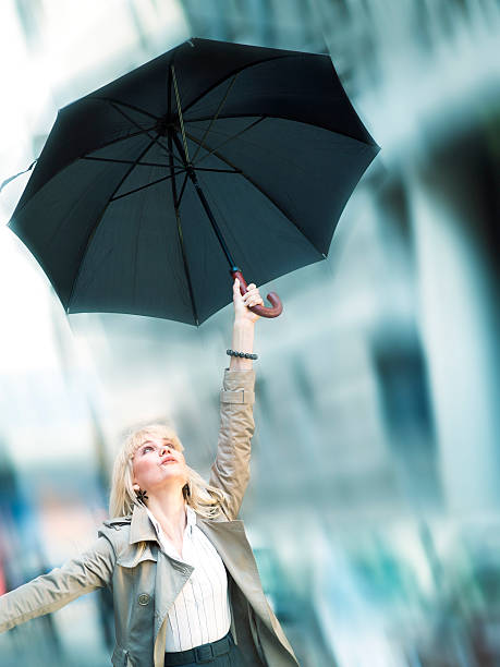 istock Woman holding her umbrella 184394333