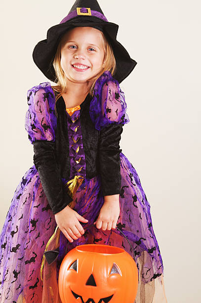 istock Girl in Halloween Witch Costume 184394364