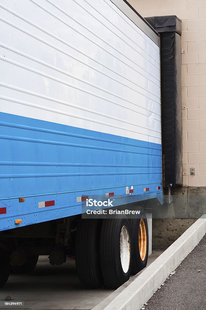 trailer and dock Trailer backed into a retail store loading dock. Carrying Stock Photo