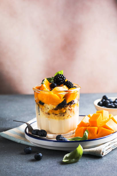 istock Trifle dessert with berries and cream on wooden table. Copy space 1843955616