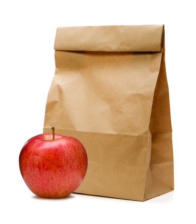 Brown Paper Bag and apple on white