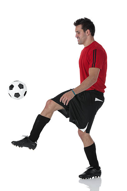 istock Man playing with a football 184396768