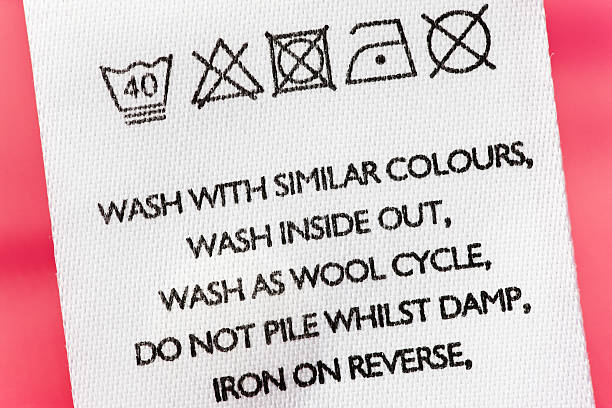 мыть инструкции по одежды label - laundry symbol стоковые фото и изображения