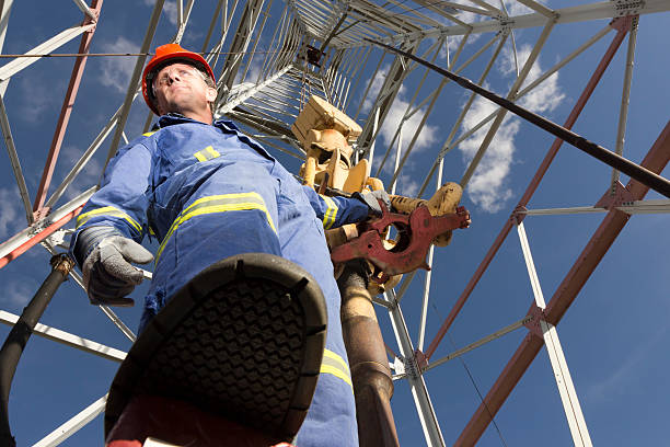 Oil Rig Worker An image from the oil industry of an oil rig worker. natural gas extraction stock pictures, royalty-free photos & images