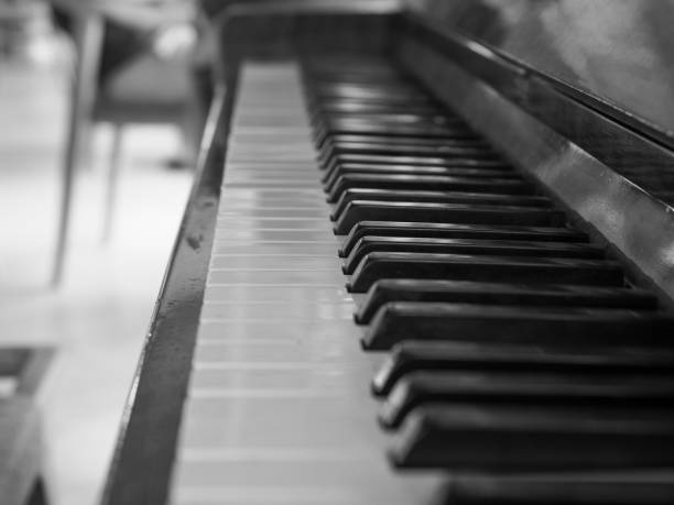 istock Playing an old wooden piano Black and white image. 1843975566