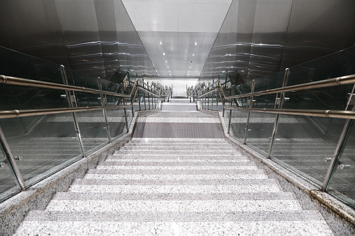 Side view of a Wooden Staircase with a Glass wall