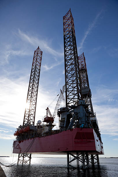 istock Overview of ocean oil rig at sunset 184397723