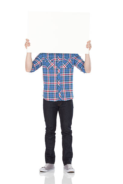 istock Man holding a placard in front of his face 184397962