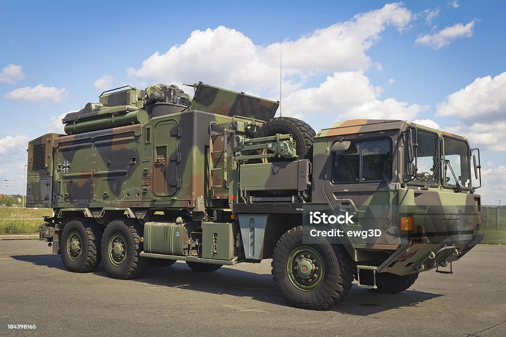 Large truck in a military camouflage German Large truck 6x6 in a military camouflageSee more MILITARY images here: Truck Stock Photo