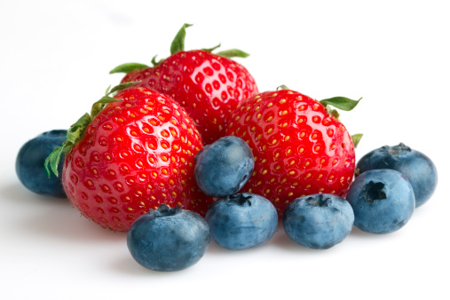 Strawberries and blueberries on white backgroundOther fruits and berries:
