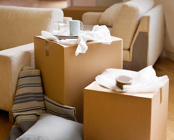 istock Moving In - Unpacked boxes of China 184398566