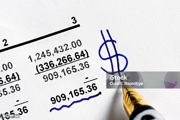 Pen Adds Dollar Sign To Financial Statement Stock Photo - Download Image Now - Bank Statement, Dollar Sign, Accounting Ledger