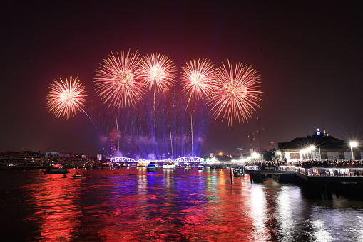 Light and firework show over the old steel bride ,Phra Phuttha Yodfa Bridge at Bangkok, Thailand Theme Vijit Chao Phraya 2023 Bangkok Thailand