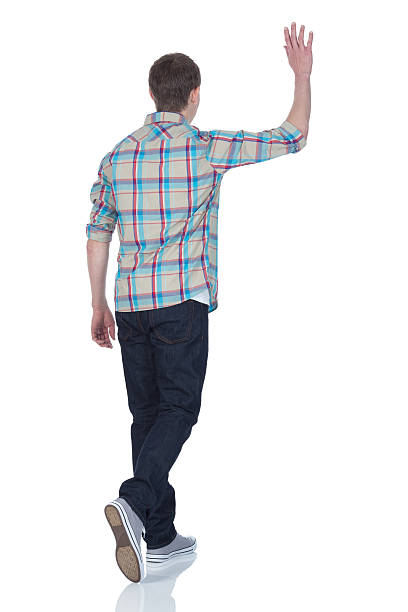 Rear view of a man waving his handhttp://www.twodozendesign.info/i/1.png
