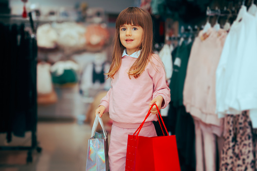 Kid enjoying shopping for fashion items on sale season