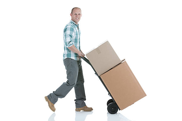 istock Man pushing cardboard boxes on a sack barrow 184400880