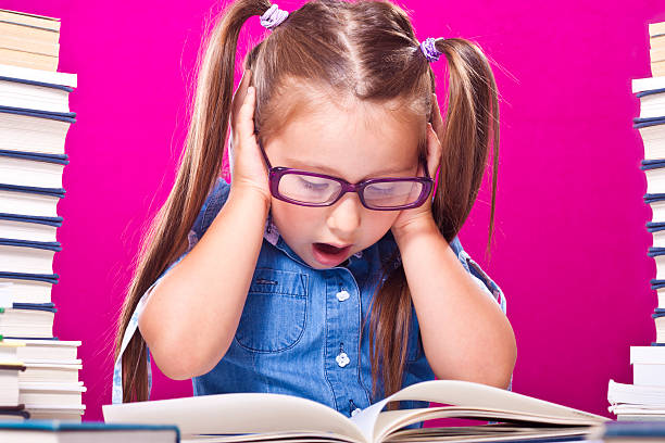 istock Little girl holding head 184400968
