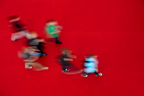 istock Group of Young People Walking on Red Carpet, Elevated View 184401111
