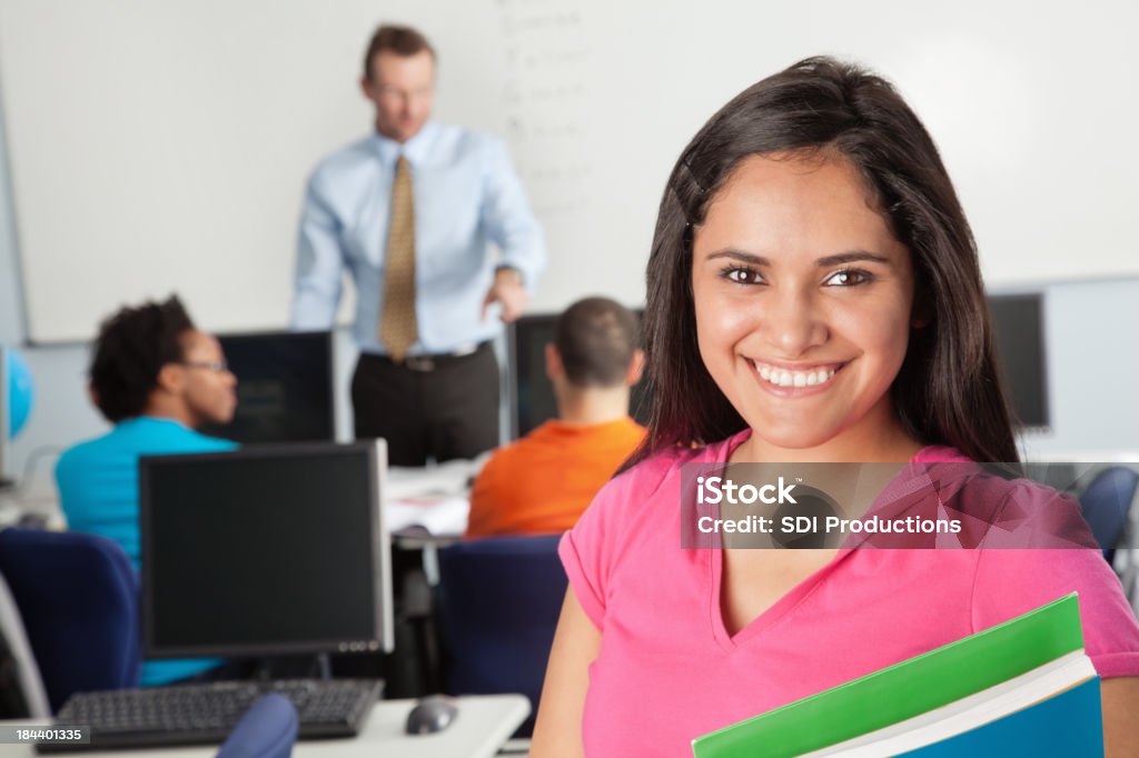 Young Female Student in Her Computer Lab Classroom Young Female Student in Her Computer Lab Classroom. Adult Stock Photo