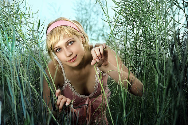 Beautiful girl smiling in a grass stock photo