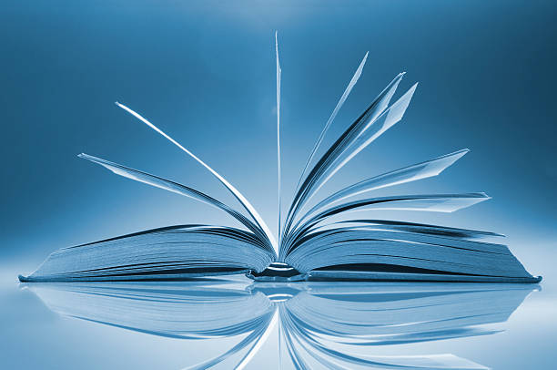 istock Open book on table with its pages fanned wide 184401718