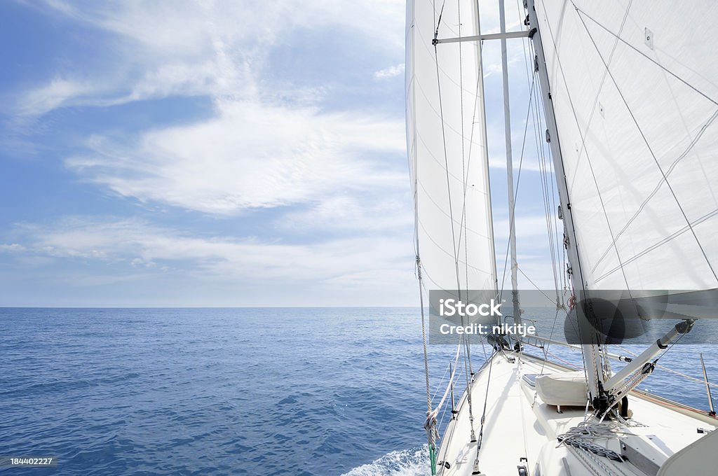 Sailing towards the horizon on a sunny day "Yacht sailing towards the horizon, French Riviera" Sailboat Stock Photo