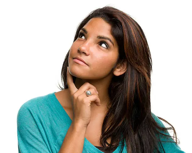 Photo of Daydreaming Young Woman Thinking, Looking Away