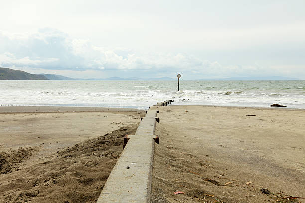 istock concrete wall at the beach leading into ocean 184403561