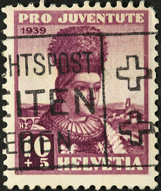 istock woman with puffy hat on an old Swiss postage stamp 184403687