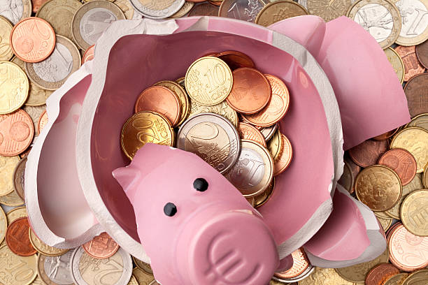 Savings. Broken piggy bank with euro coins Savings. Broken piggy bank with euro coins. european union coin photos stock pictures, royalty-free photos & images