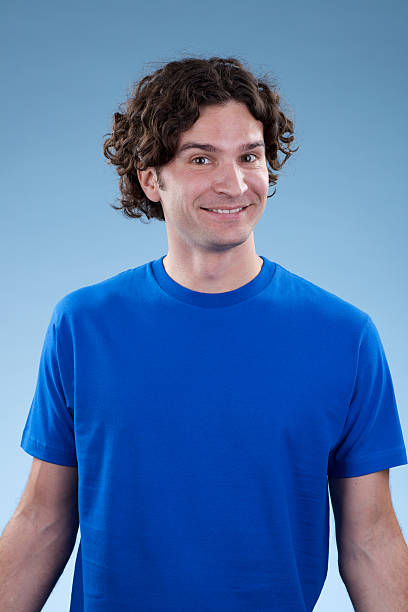istock Smiling, young white male with blue shirt 184404214