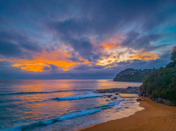 istock Northern Beaches Sunrise at the seaside with rain clouds 1844045318