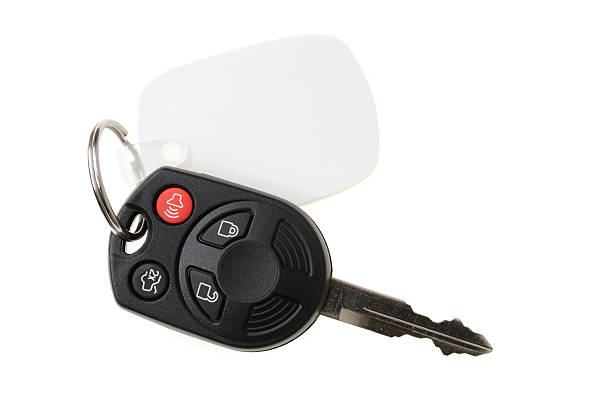 Automotive Remote Key on White Automotive remote key on white key ring stock pictures, royalty-free photos & images