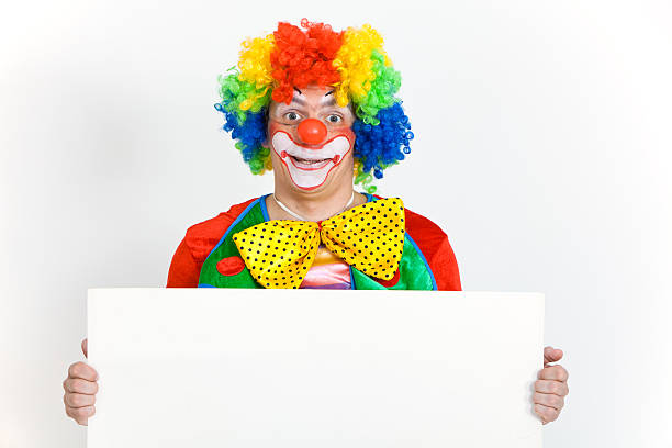 istock Happy clown holding blank banner with copy space 184404656