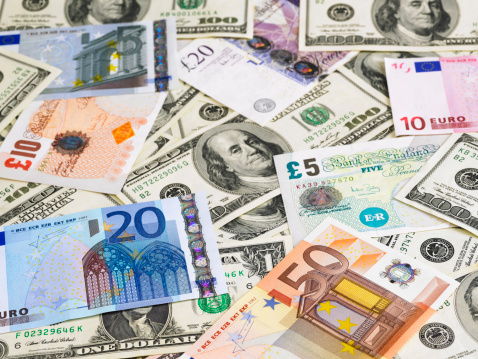 Lots of different Euro banknotes shown as a mess