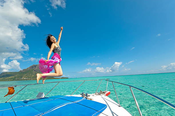 istock Girl jumping on boat 184405301