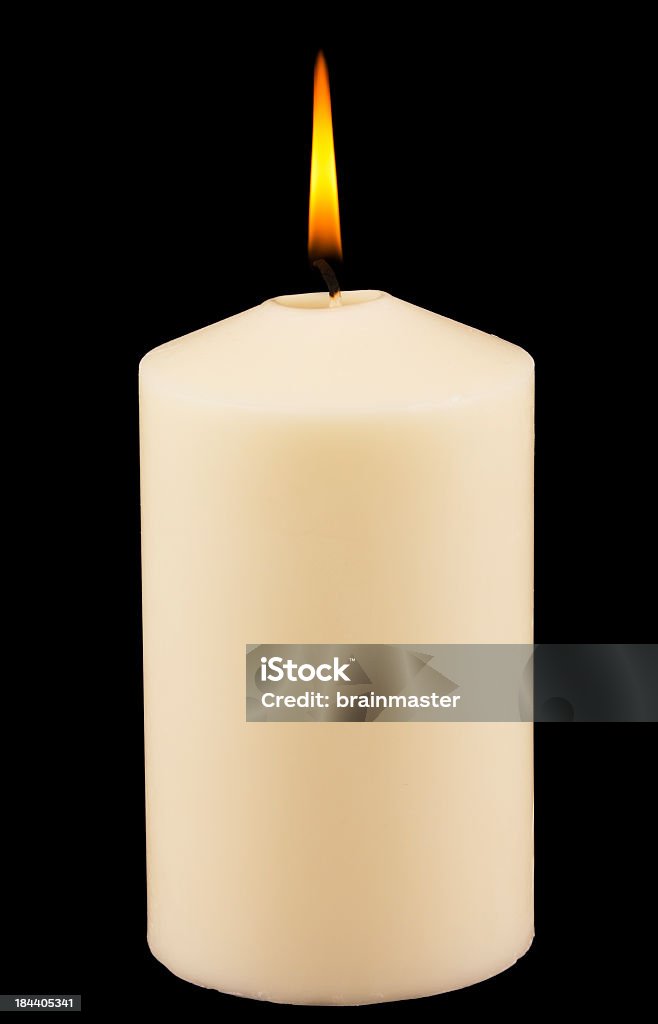 Lit white candle against black background White candle agains black isolated background. Candle Stock Photo