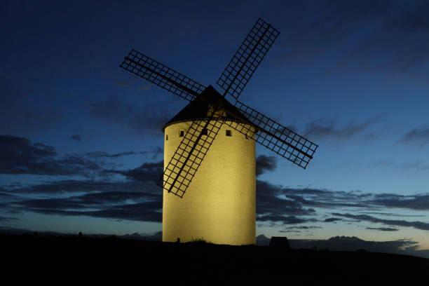 Night photography of illuminated windmills in Campo de Criptana, Ciudad Real. Castilla la Mancha. Don Quixote scene