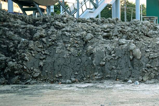 A pile of soil from digging machine backside is stairs to take the train, constructions concepts.