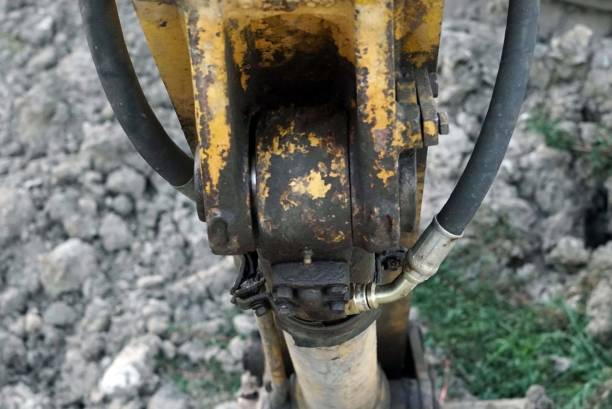 istock Close up Hydraulic hose cable connected with a hydraulic cylinder for backhoe. 1844074578