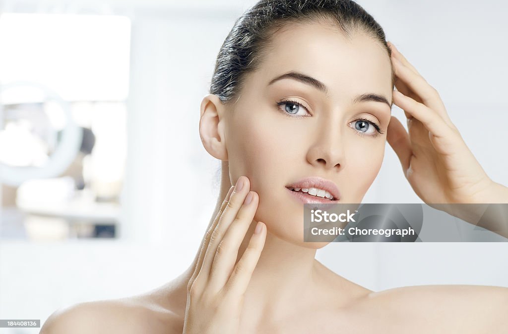 healthy face beauty woman on the bathroom background Adult Stock Photo