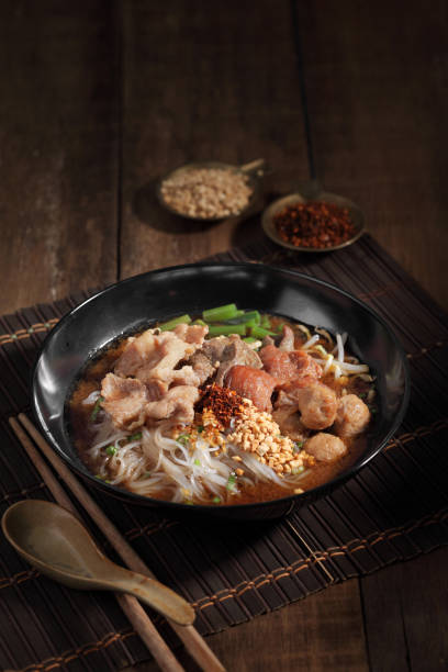 Chinese beef noodle soup. Taiwanese beef noodle on wooden background.