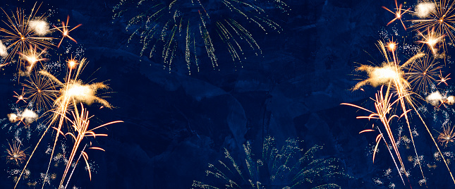 Colorful Fireworks on blue background with copy space for New Year celebration concept