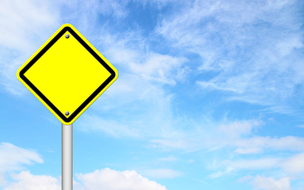 istock blank yellow traffic sign with blue sky 184411958